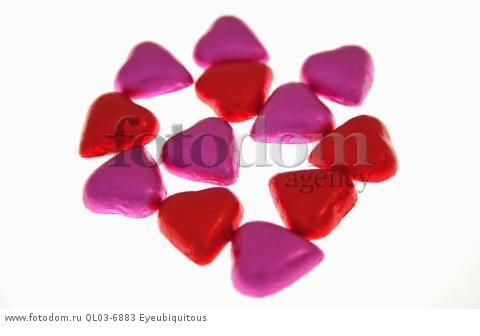 Food, Confections, Chocolate hearts covered in pink and red coloured foil.