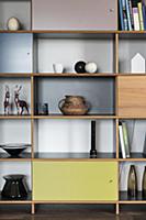 Minimalist decoration on shelving with compartment
