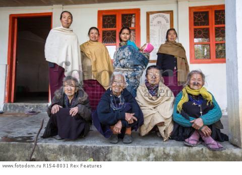 Mandatory Credit: Photo by Solent News/REX Shutterstock (4909075i)
Some of the Apatani women with their facial tattoo and nose plugs
Apatani tribal women, Arunachal Pradesh, India - Apr 2015
*Full story: http://www.rexfeatures.com/nanolink/qoi2
A photographer was given unique access to incredible tribal women who each have the same facial tattoo and nose plugs. Cezary Wyszynski, 38, stayed with the Apatani people in India whose women all went through the dramatic face-changing ritual when they had their first period. A guide took Cezary through their villages in the Ziro Valley in Arunachal Pradesh, India, where the last known 'plugging and tattooing' happened in 1972. The ancient tradition no longer takes place but women aged over 50 still display their remarkable wooden nose plugs - while others have removed them and had plastic surgery afterwards. The reason the younger women do not have the same distinctive features is because when they mixed with people from other cultures people declined to mix because they looked so unusual.