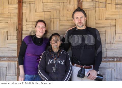 Mandatory Credit: Photo by Solent News/REX Shutterstock (4909075n)
Photographer Cezary Wyszynski with his wife Desiree van Thiel posing with one of the Apatani women with her facial tattoo and nose plugs
Apatani tribal women, Arunachal Pradesh, India - Apr 2015
*Full story: http://www.rexfeatures.com/nanolink/qoi2
A photographer was given unique access to incredible tribal women who each have the same facial tattoo and nose plugs. Cezary Wyszynski, 38, stayed with the Apatani people in India whose women all went through the dramatic face-changing ritual when they had their first period. A guide took Cezary through their villages in the Ziro Valley in Arunachal Pradesh, India, where the last known 'plugging and tattooing' happened in 1972. The ancient tradition no longer takes place but women aged over 50 still display their remarkable wooden nose plugs - while others have removed them and had plastic surgery afterwards. The reason the younger women do not have the same distinctive features is because when they mixed with people from other cultures people declined to mix because they looked so unusual.