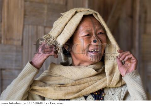 Mandatory Credit: Photo by Solent News/REX Shutterstock (4909075m)
One of the Apatani women with her facial tattoo and nose plugs
Apatani tribal women, Arunachal Pradesh, India - Apr 2015
*Full story: http://www.rexfeatures.com/nanolink/qoi2
A photographer was given unique access to incredible tribal women who each have the same facial tattoo and nose plugs. Cezary Wyszynski, 38, stayed with the Apatani people in India whose women all went through the dramatic face-changing ritual when they had their first period. A guide took Cezary through their villages in the Ziro Valley in Arunachal Pradesh, India, where the last known 'plugging and tattooing' happened in 1972. The ancient tradition no longer takes place but women aged over 50 still display their remarkable wooden nose plugs - while others have removed them and had plastic surgery afterwards. The reason the younger women do not have the same distinctive features is because when they mixed with people from other cultures people declined to mix because they looked so unusual.