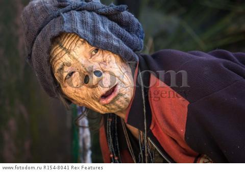 Mandatory Credit: Photo by Solent News/REX Shutterstock (4909075d)
One of the Apatani women with her facial tattoo and nose plugs
Apatani tribal women, Arunachal Pradesh, India - Apr 2015
*Full story: http://www.rexfeatures.com/nanolink/qoi2
A photographer was given unique access to incredible tribal women who each have the same facial tattoo and nose plugs. Cezary Wyszynski, 38, stayed with the Apatani people in India whose women all went through the dramatic face-changing ritual when they had their first period. A guide took Cezary through their villages in the Ziro Valley in Arunachal Pradesh, India, where the last known 'plugging and tattooing' happened in 1972. The ancient tradition no longer takes place but women aged over 50 still display their remarkable wooden nose plugs - while others have removed them and had plastic surgery afterwards. The reason the younger women do not have the same distinctive features is because when they mixed with people from other cultures people declined to mix because they looked so unusual.