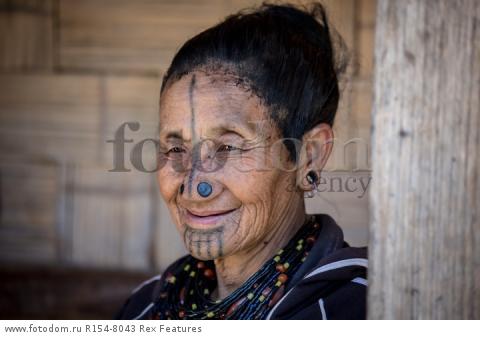 Mandatory Credit: Photo by Solent News/REX Shutterstock (4909075p)
One of the Apatani women with her facial tattoo and nose plugs
Apatani tribal women, Arunachal Pradesh, India - Apr 2015
*Full story: http://www.rexfeatures.com/nanolink/qoi2
A photographer was given unique access to incredible tribal women who each have the same facial tattoo and nose plugs. Cezary Wyszynski, 38, stayed with the Apatani people in India whose women all went through the dramatic face-changing ritual when they had their first period. A guide took Cezary through their villages in the Ziro Valley in Arunachal Pradesh, India, where the last known 'plugging and tattooing' happened in 1972. The ancient tradition no longer takes place but women aged over 50 still display their remarkable wooden nose plugs - while others have removed them and had plastic surgery afterwards. The reason the younger women do not have the same distinctive features is because when they mixed with people from other cultures people declined to mix because they looked so unusual.