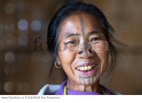 Mandatory Credit: Photo by Solent News/REX Shutterstock (4909075l)
One of the Apatani women with her facial tattoo and nose plugs
Apatani tribal women, Arunachal Pradesh, India - Apr 2015
*Full story: http://www.rexfeatures.com/nanolink/qoi2
A photographer was given unique access to incredible tribal women who each have the same facial tattoo and nose plugs. Cezary Wyszynski, 38, stayed with the Apatani people in India whose women all went through the dramatic face-changing ritual when they had their first period. A guide took Cezary through their villages in the Ziro Valley in Arunachal Pradesh, India, where the last known 'plugging and tattooing' happened in 1972. The ancient tradition no longer takes place but women aged over 50 still display their remarkable wooden nose plugs - while others have removed them and had plastic surgery afterwards. The reason the younger women do not have the same distinctive features is because when they mixed with people from other cultures people declined to mix because they looked so unusual.