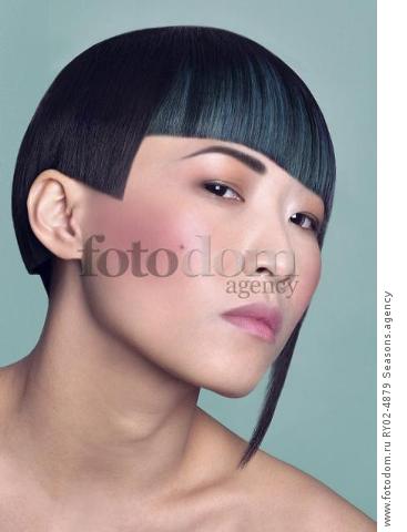 An oriental woman with an unusual asymmetric hairstyle