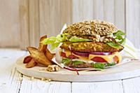 A vegetable burger with walnuts and celery