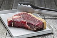 Raw dry aged T-bone steak